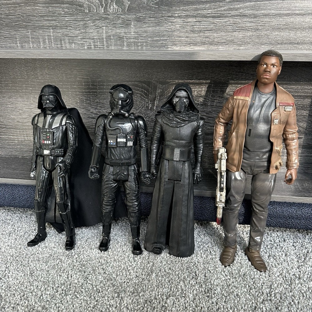 Star Wars action figures Darth Vader, a TIE Fighter Pilot, Kylo Ren, and Finn
